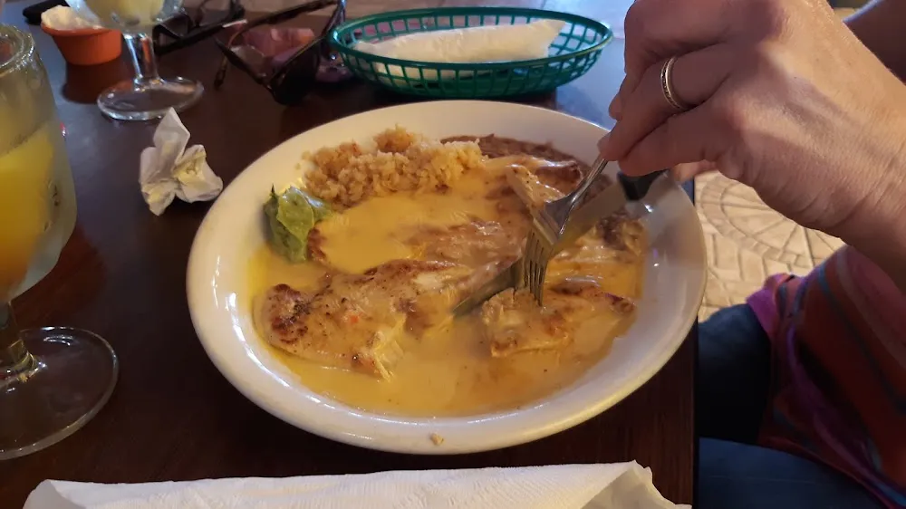 Cheese and Beef Enchilada with Refried Beans and Rice