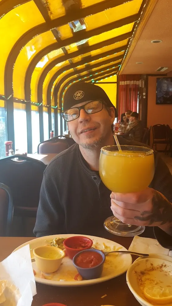 Richard Drinking His Mango Margarita